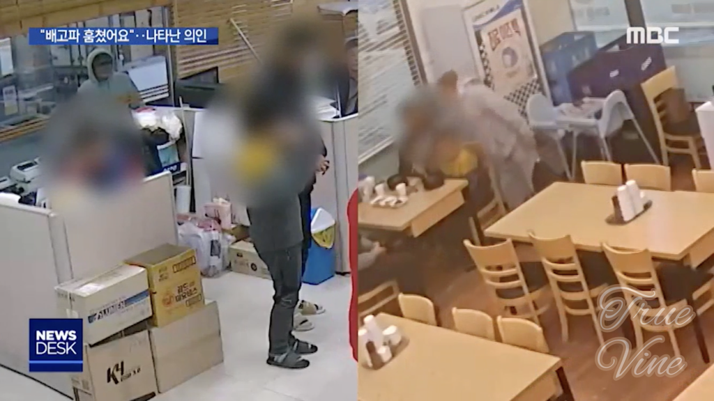 灰色の服の男性